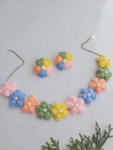 multicolored floral necklace and earrings in pastel colors